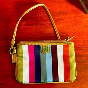 Coach wristlet. Barely used. New condition. Very cute and colorful.